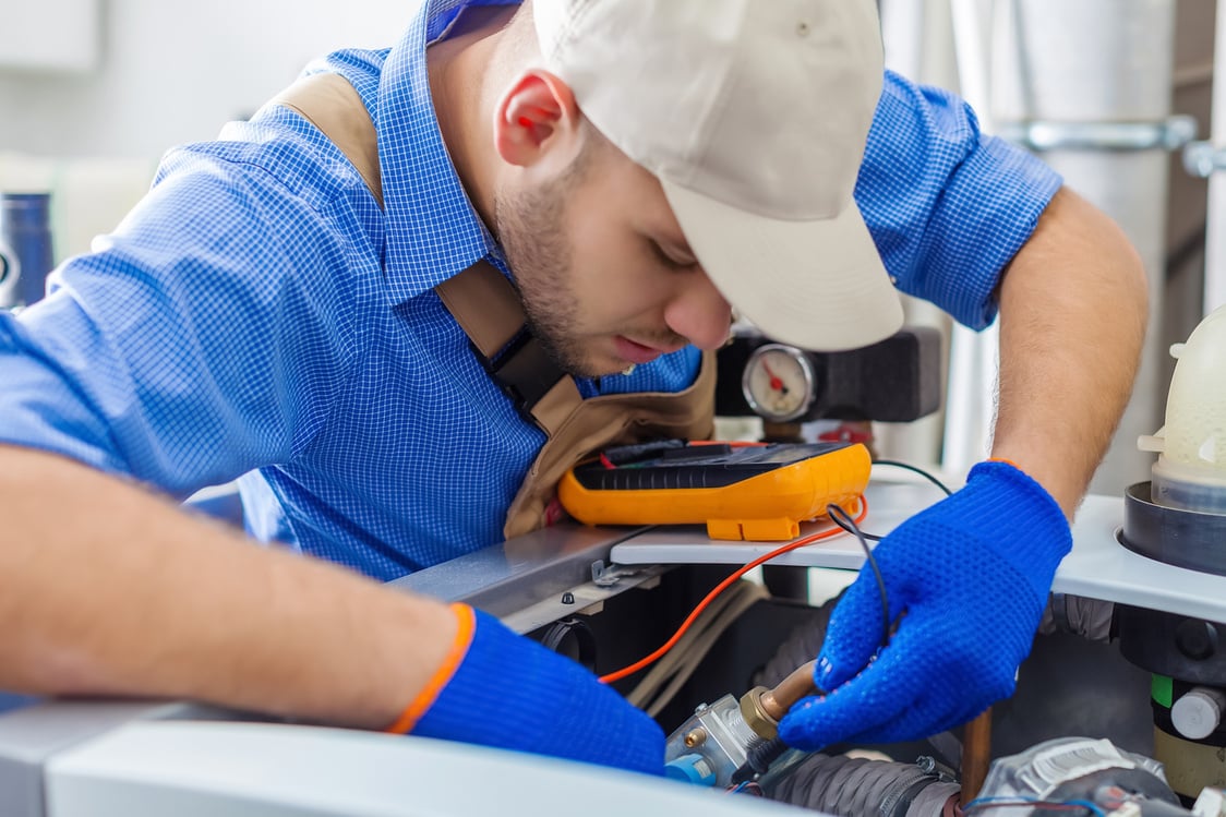 Handsome Professional Plumber Fixing Pipes. Plumbing Repair Service.