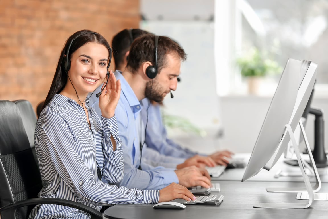 Team of Technical Support Agents Working in Office